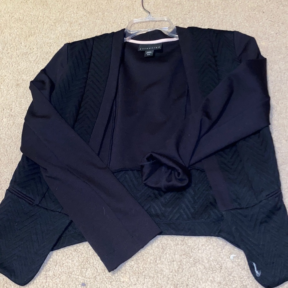 Black blazer goes all the way down to wrist